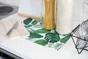 Nappe cirée manhattan gourmet aqua couverts/verre vert 140cm au mètre