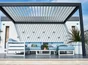 Pergola bioclimatique adossée Caleta aluminium, 12 m² gris anthracite